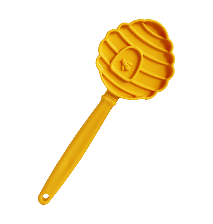 Gelber Licki Stick mit bienenstockförmiger Oberfläche und langem Griff.